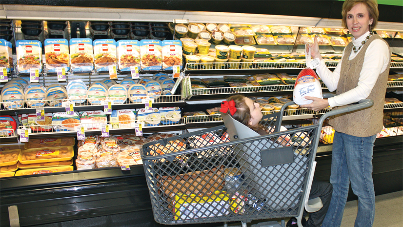 Drew Ann Long takes her daughter shopping in Caroline's Cart.
