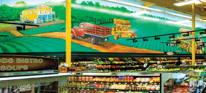 A mural over the produce department depicts Woods’ first store.