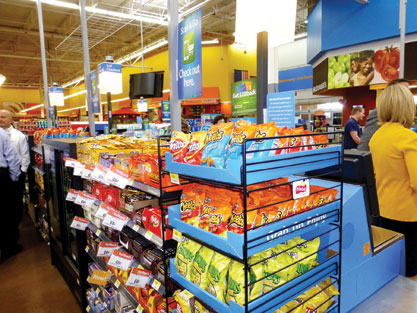 Wal-Mart has rededicated itself to self-checkout behind a new “bullpen” layout also offering merchandising opportunities.”