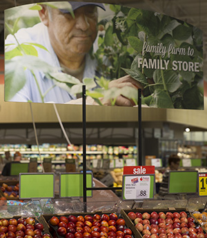 Retailers like Meijer use in-store signage to advertise local produce efforts.