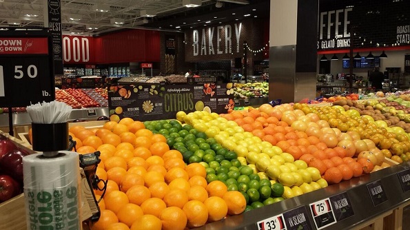 A large produce selection, dramatic signage and a Naturally Better health food section greet customers. 