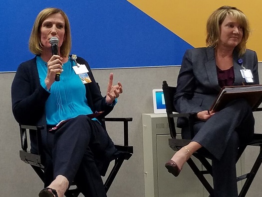 Pippa Pomeroy (left) and Michelle Knight discuss worker training and development initiatives at Walmart.