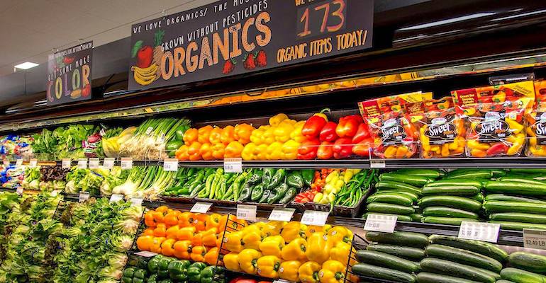 Fresh organic vegetable selection in produce aisle at grocery store  supermarket. Stock Photo