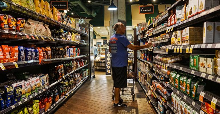 Independent grocers-elderly-man-walking-food-store-coronavirus.jpg