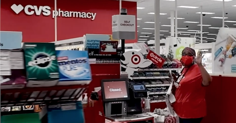 Target_checkout_worker-CVS_Pharmacy_sign.png