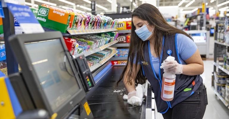Walmart cashier-COVID19 cleaning.jpeg