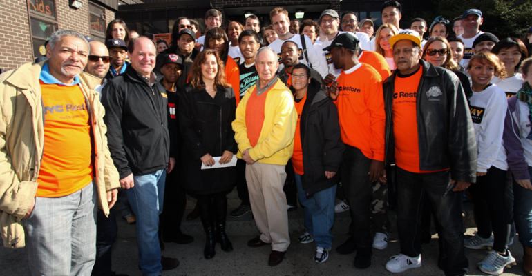 Bill Sanford front row second from left president of Fairway Constance Costas principal of the marketing and business development firm Greenhill Agency and Mayor Bloomberg are surrounded by Fairway and NYC Restore volunteers