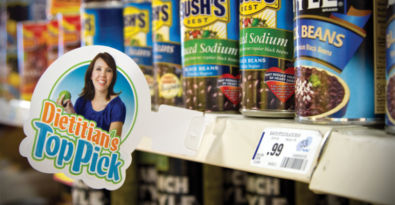 A photo of Alicia Jerome corporate dietitian for United Supermarkets adorns shelf talkers