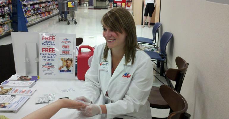 Price Chopper pharmacist Kim Housner counsels a diabetes patient