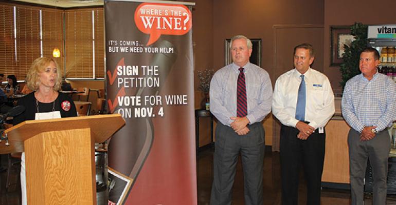 Melissa Eads at podium spokeswoman for Krogerrsquos Nashville division introduces the petition drive Also pictured left to right are Rick Going president of the Nashville division of Kroger Steve James VP of merchandising for Krogerrsquos Nashville division and Scott Means president of SampC Foods