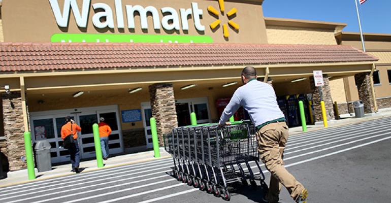 Walmart 2Q earnings dip, outlook trimmed