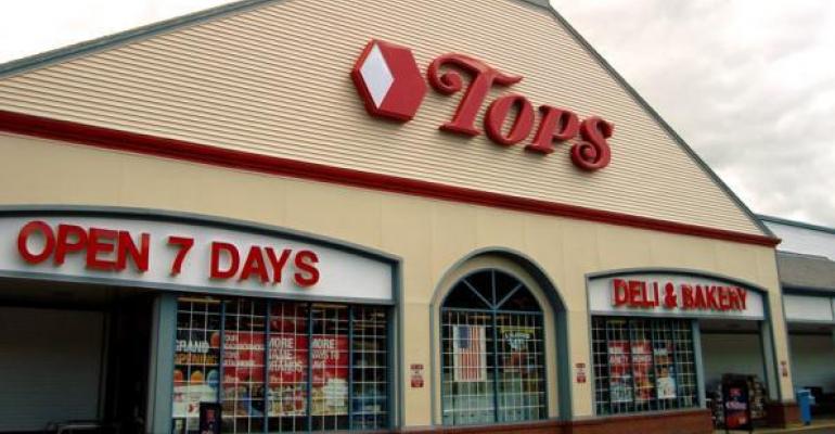 Tops cuts losses in 2Q; deflation dings comps