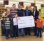 Scott Belcher store manager of Giant39s Stone Road store in Centreville Va third from right and Felis Andrade director of marketing and external communications for Giant Food present winner Sarah Calamore and her family with the prize