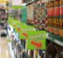 Green shelf tags call attention to items that have lower prices