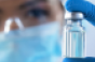 Albertsons-COVID_vaccine_vial-pharmacist.png