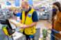 Walmart_store_associate_with_customer-checkout.jpg