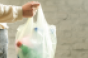 Woman-plastic-bag-single-use-plastic-waste.png