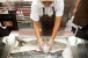 A New Seasons Market employee prepares sustainably raised seafood