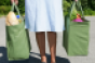 woman-holding-shopping-bags.png