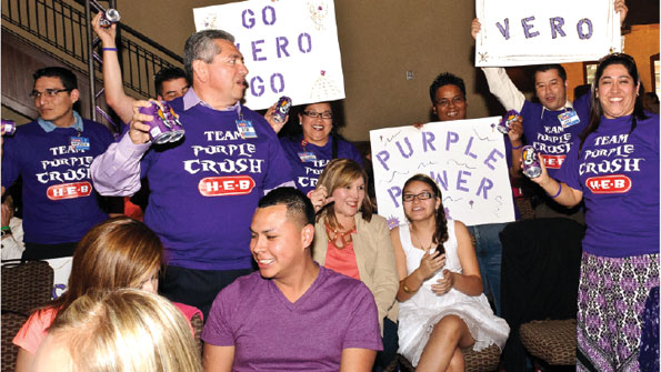 Employees cheer for their favorite contestant at the H-E-B Slim Down Showdown finale.  A consumer version is under way.