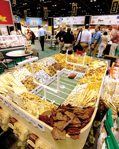 The team merchandises chips and crackers in an intricate “snack stadium.”