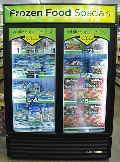 A frozen-food endcap touts low prices. The format is most successful in small markets underserved by traditional food retailers.
