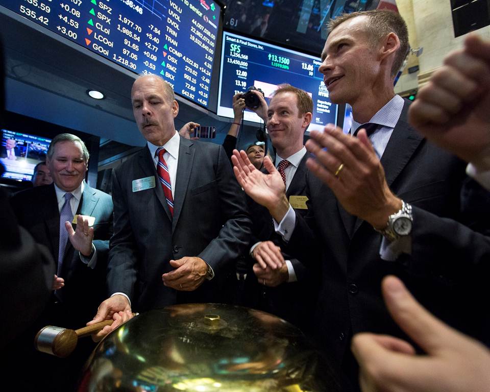 Dave Hirz (second from left), president and CEO of Smart & Final, launches trading on the company's common stock, flanked by Richard Phegley, Smart & Final's CFO; Dennis Gies, principal in Ares Managmenet, which owns the majority stake in Smart & Final; and David A. Ethridge, SVP and head of the Capital Markets Group at NYSE Euronext.