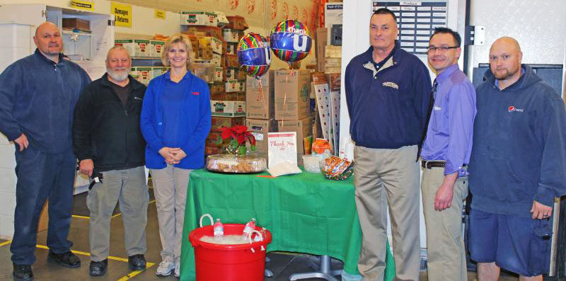 Weis Markets this week is saluting DSD vendors with free food and beverages at its stores. Pictured from left are Mark Gribble, Snyder’s; Stan Yageo, Martin’s Potato Chips; Cindy Mull, Weis Markets receiver; Ron Benne, Tastykake; Jim Malick, Weis Markets store manager; and Brian Barner, Pepsi. (Photo courtesy of Weis Markets)